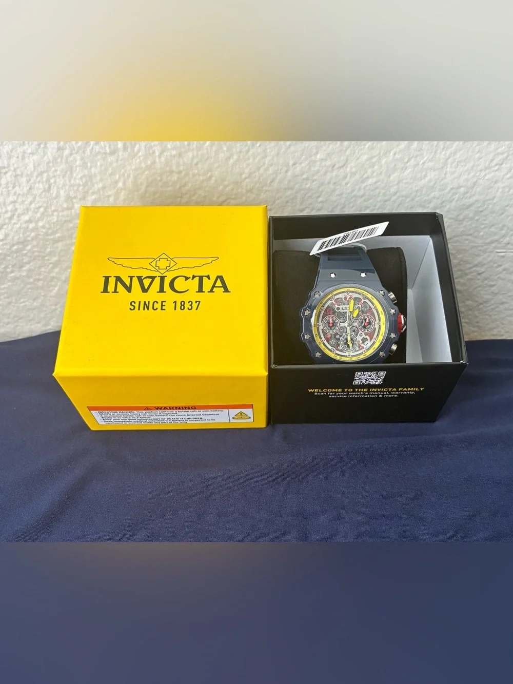 Invicta Navy Blue Watch with Yellow Accents and Red Details